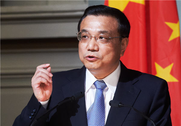 China to keep economy within reasonable range, act to ease commodity prices