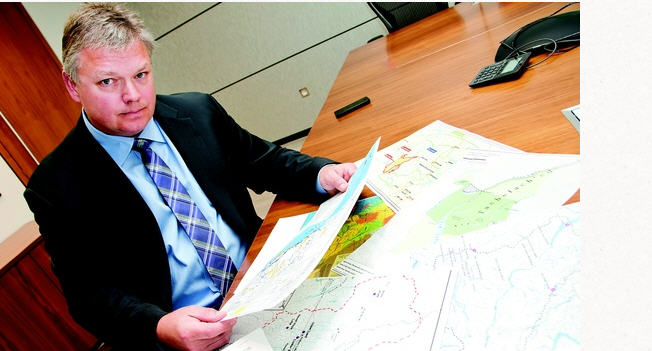 McMillian LLP Lawyer Robin Junger, who specializes in aboriginal land claims, sorting through maps in his Vancouver Office l Chung Chow