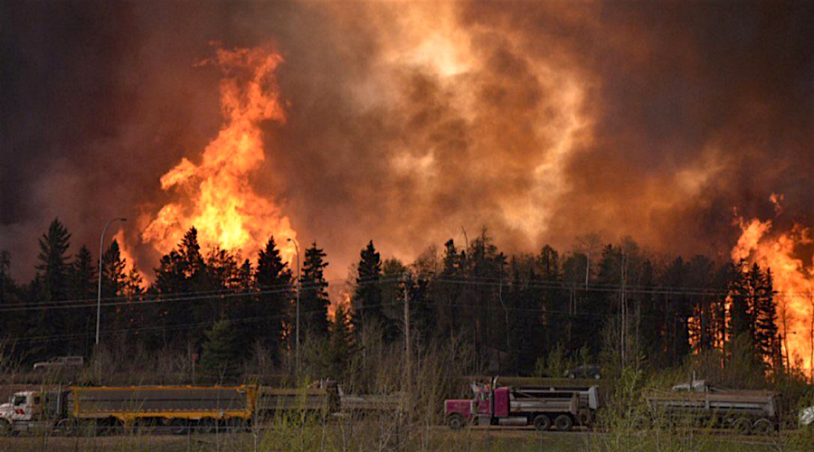 Canadian oil sands camps evacuated as wildfire shifts north