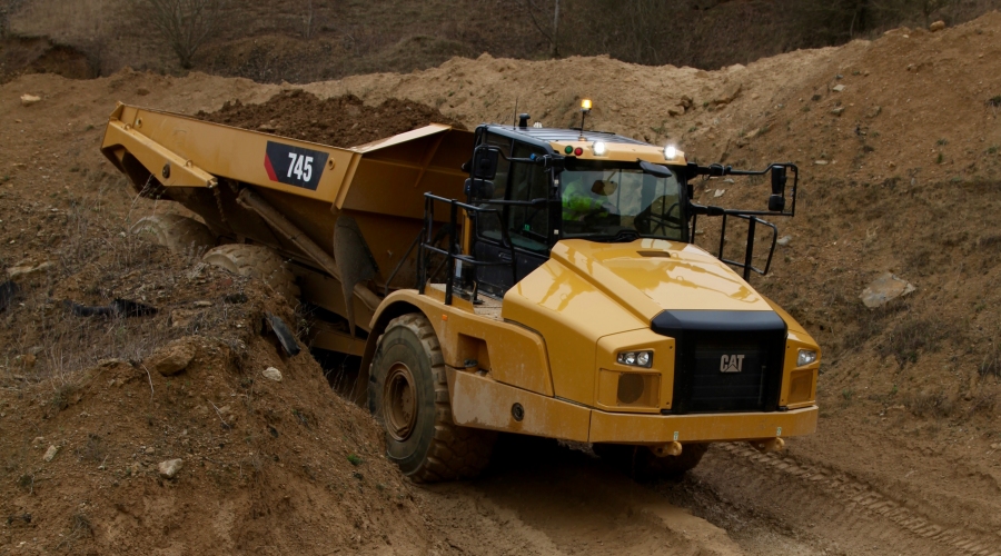 Cat 745 Articulated Truck on muddy road