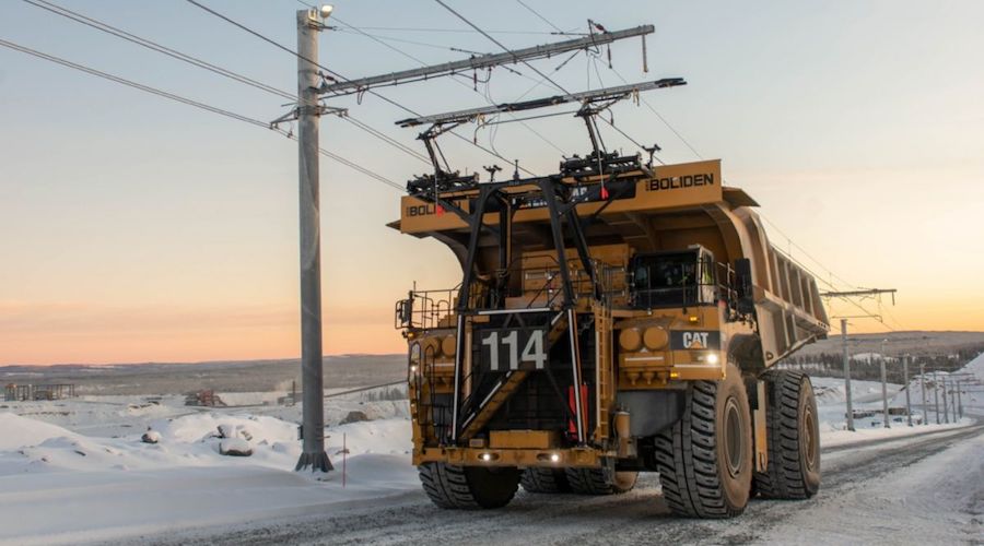 Cat 795 AC mining truck on trolley at Boliden Aitik mine