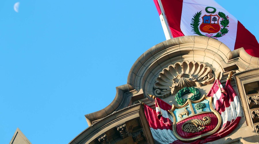 Peru's Presidential Palace and flag.